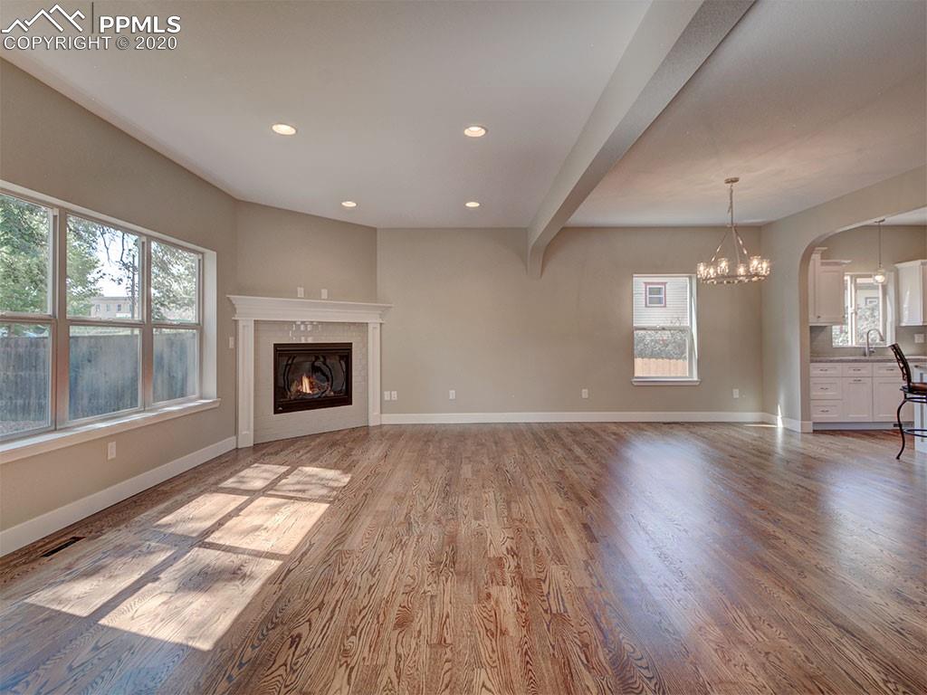 208 Custer Avenue Colorado Springs, CO 80903 - Photo 4 of 36 Open family room, upgraded 42" gas fireplace