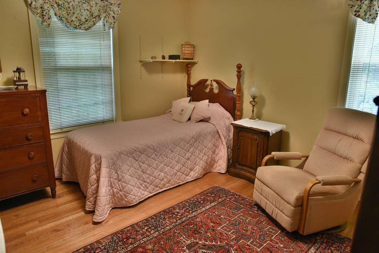 5291 Shady Grove Road Memphis, TN 38120 - Photo 14 of 23 Bedroom 3 has lots of natural light and original hardwood floors.