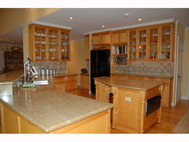 5495 North Angela Road Memphis, TN 38120 - Photo 2 of 9 One view of kitchen showing island, some of the abundant cabinet space, granite countertops and island.