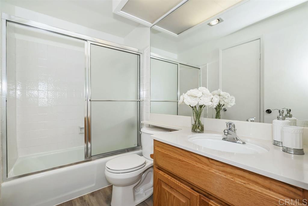 7855 Hummingbird Lane San Diego, CA 92123 - Photo 13 of 25 Full bathroom is accessible from the hallway, or the master bedroom.