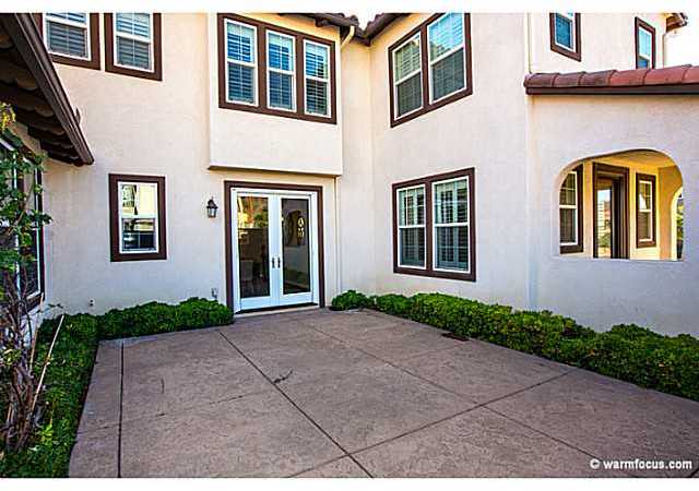 17173 Ralphs Ranch Road San Diego, CA 92127 - Photo 5 of 16 French doors lead from the home to the courtyard with stamped, colored concrete.