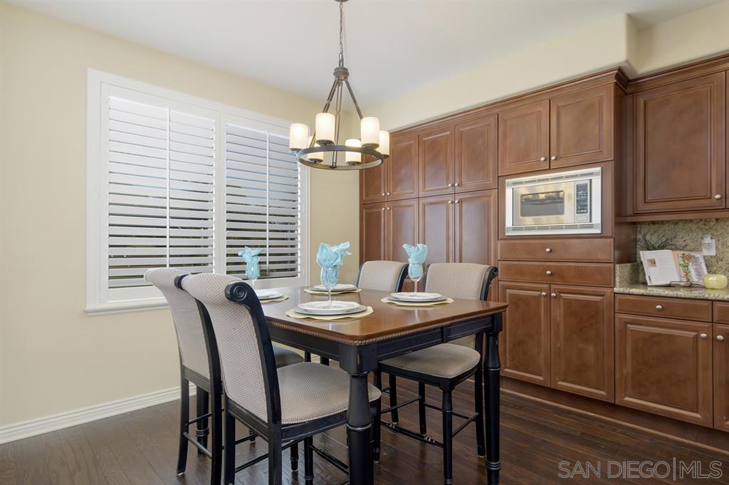 14449 Whispering Ridge Road San Diego, CA 92131 - Photo 9 of 25 Large eat in breakfast area overlooks the parklike backyard.