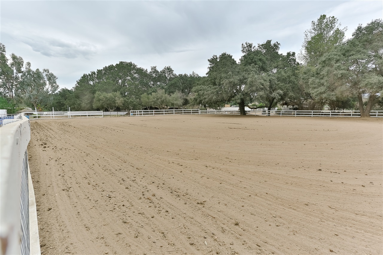 15428 Glentree Road Valley Center, CA 92082 - Photo 8 of 25 Huge Horse arena! 165' x 135', 22,000 sf arena partially shaded with hundred year old oak trees for shaded summer riding.