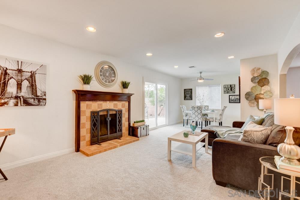 14215 Powers Road Poway, CA 92064 - Photo 2 of 25 Enjoy movie night in your spacious family room complete with a cozy fireplace.