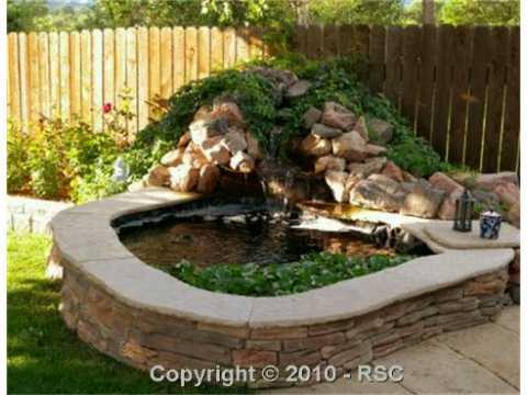 649 Paradise Lane Colorado Springs, CO 80904 - Photo 13 of 13 Mature Koi in pond with waterfall.