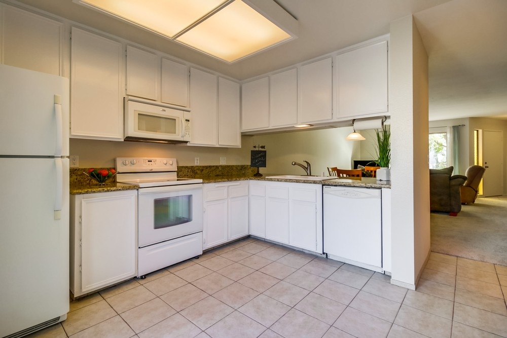 6341 Rancho Mission Road, Unit 3 San Diego, CA 92108 - Photo 6 of 25 Huge kitchen space with attached laundry room and half bath