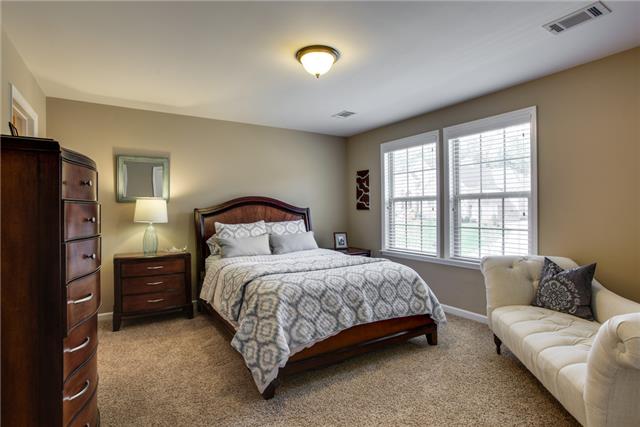 3124 Herbert Drive Franklin, TN 37067 - Photo 31 of 45 Another bedroom with connected bathroom with walk-in closet and wood shelving