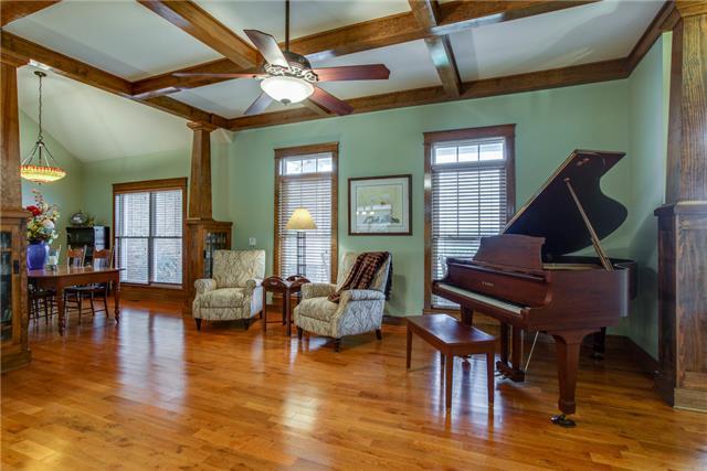 13920 Patterson Road College Grove, TN 37046 - Photo 9 of 30 The formal living room to the right features a coffered ceiling in addition to those beautiful hardwood floors.