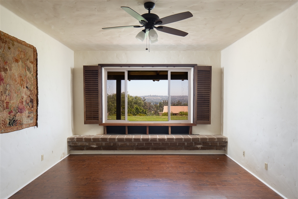 401 Wilshire Road Oceanside, CA 92057 - Photo 13 of 25 Family room has brick window seat for taking in the gorgeous views from the expansive window. Custom shudders on many windows.