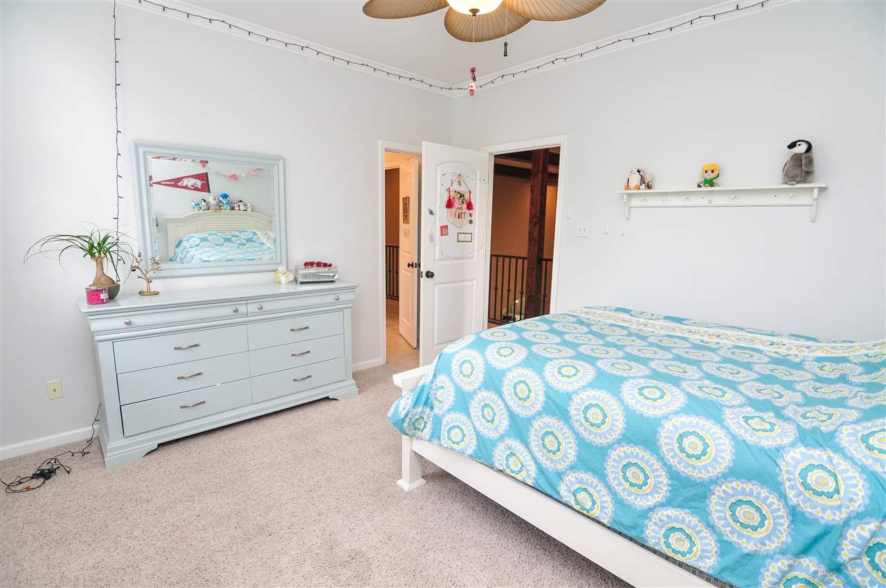 345 Windover Road Piperton, TN 38017 - Photo 18 of 25 The 5th bedroom is also upstairs and features high ceilings with fan, carpet, large walk-in closet, and access into the upstairs bath.