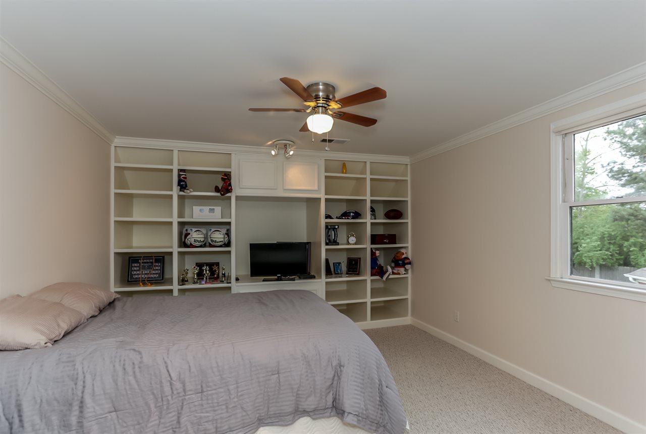 458 Duscoe Street Collierville, TN 38017 - Photo 15 of 25 Large bedroom finished off after home was built. This large room has built in bookshelves and a large walkin 6'x 12' closet with built in desk. (See next photo)