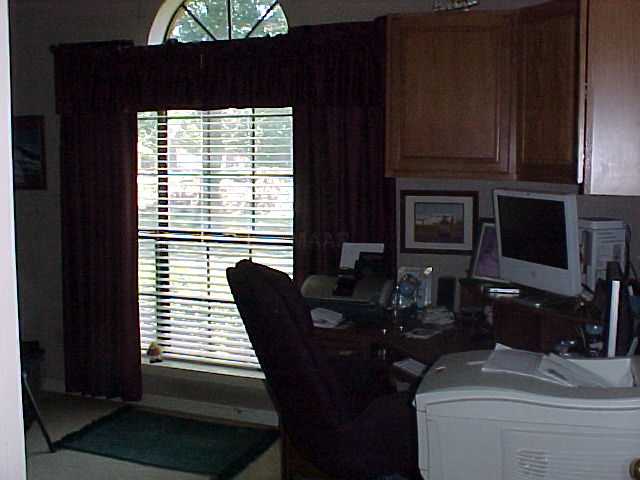 7048 Deerfield Road Bartlett, TN 38135 - Photo 8 of 12 The fourth bedroom is presently used as an office. This home is very versatile. It would also work great for in laws since the master bedroom & this office are separated from the other bedrooms.