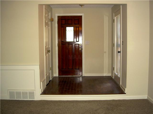 7103 Belsfield Road Memphis, TN 38119 - Photo 2 of 25 Entrance has beautiful wood door, hardwood floor and a large entry closet.