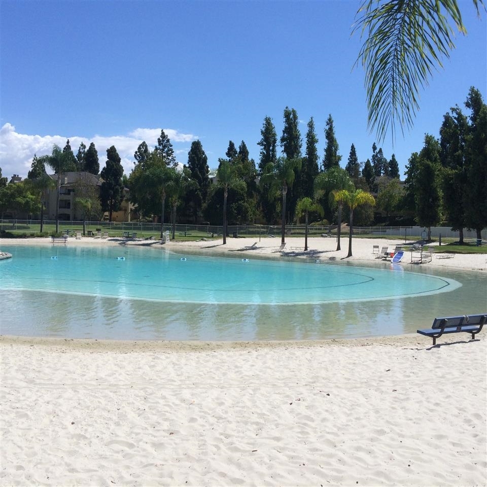 755 Brookstone Road, Unit 101 Chula Vista, CA 91913 - Photo 19 of 23 Private Community Beach Club, with a swimming pool built as a Caribbean lagoon with sand shores, barbecue pits, two volleyball courts, two tennis courts and a community room.