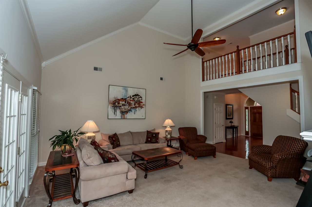 458 Duscoe Street Collierville, TN 38017 - Photo 5 of 25 So much space for living! Tall, smooth ceilings with balcony above! Lovely ceiling fan! Room overlooks beautiful backyard and swimming pool!