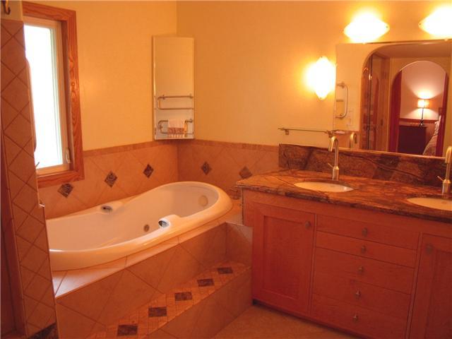 13319 Stone Canyon Road Poway, CA 92064 - Photo 19 of 22 Master Bathroom includes Heated Jet Tub, Steam Shower a Deux, Custom Cabinets, Dual Sinks, "Rainforest Custom Marble Vanity", Dual Heated Towel Racks, and plumbing for a Bidet.