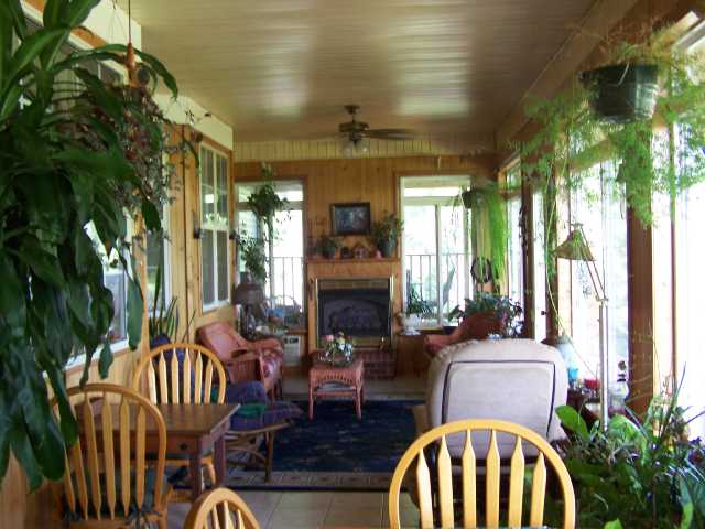 160 Gay Road Covington, TN 38019 - Photo 3 of 5 GLASSED SUNROOM ON BACK OF HOUSE. JUST BEYOND SUNROOM IS A SCREENED-IN PORCH.