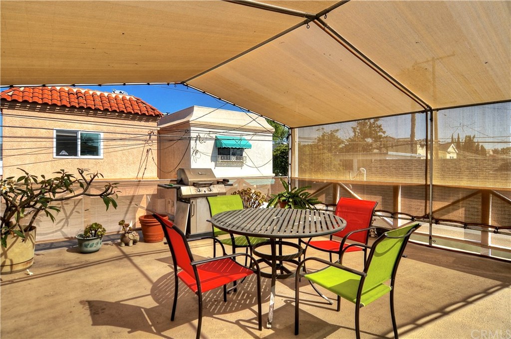 253 17th Street Seal Beach, CA 90740 - Photo 30 of 36 Valuable outdoor space or perfect for a family gathering. A separate staircase leads to this deck to provide a private entrance for guests.