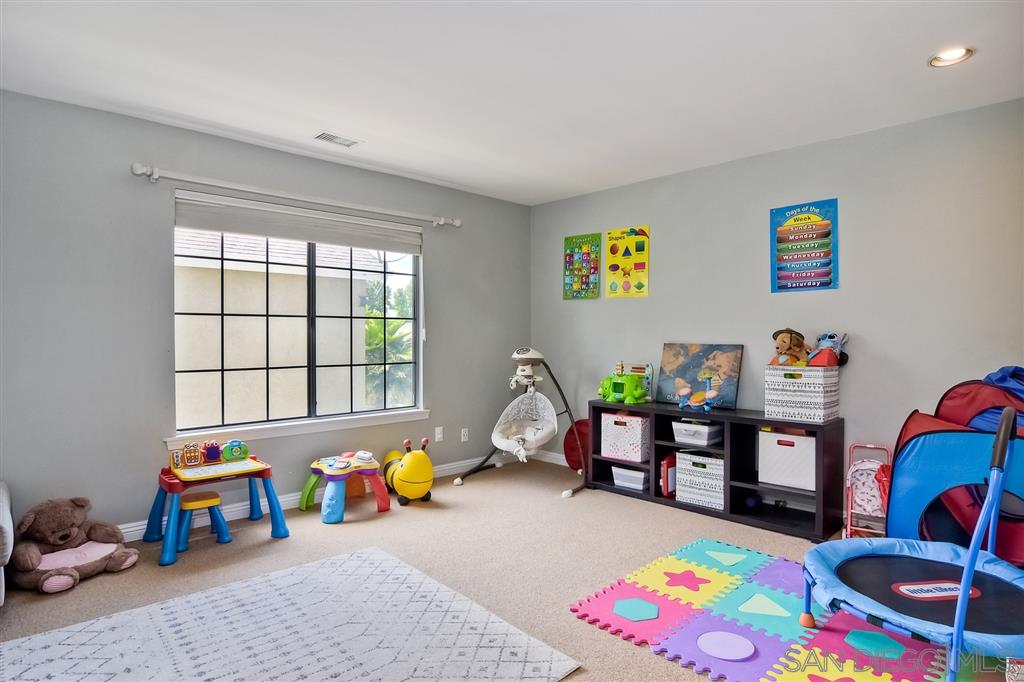 3756 Brand Crest Encinitas, CA 92024 - Photo 15 of 25 2nd & 3rd bdrm made to one room. speakers have been put in ceilings.
