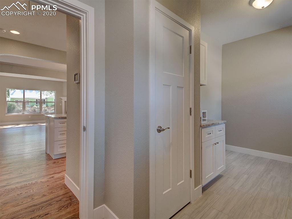 208 Custer Avenue Colorado Springs, CO 80903 - Photo 13 of 36 Mud room to the right, with W/D hook-ups, full pantry and large coat closet.