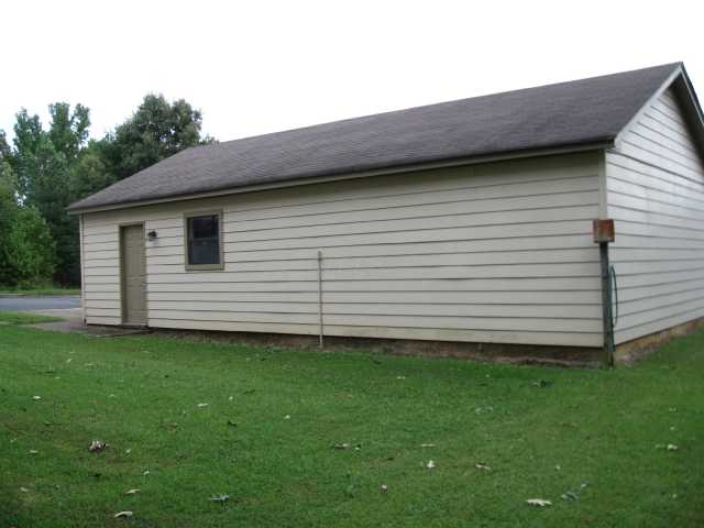 Workshop  with cabinet space and Garage area.