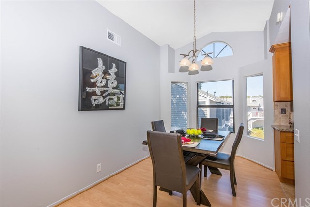 131 Remington, Unit 239 Irvine, CA 92620 - Photo 11 of 36 Laminate floors in the dining area makes wiping up spills a breeze!