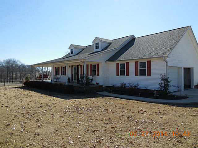 4087 Poplar Grove Road Halls, TN 38040 - Photo 3 of 24 This wrap around porch adds appeal to this country dream!!