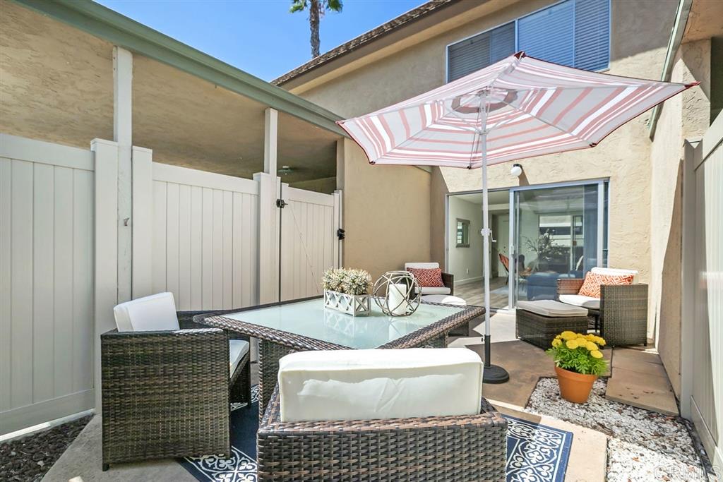 7855 Hummingbird Lane San Diego, CA 92123 - Photo 19 of 25 Enjoy San Diego's beautiful weather all year from one of two patio. The back patio is accessible from the living room and the carport area.