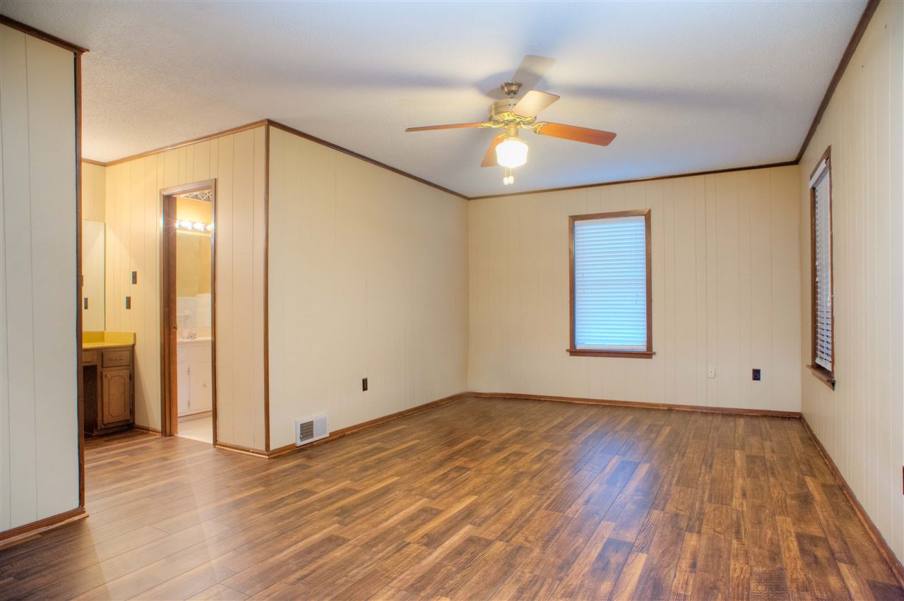 8380 Donnell Road Millington, TN 38053 - Photo 12 of 22 18x12 Master Bedroom Suite with Private Bath including Make-Up Area and Separte Vanity, plus Door to Sunroom