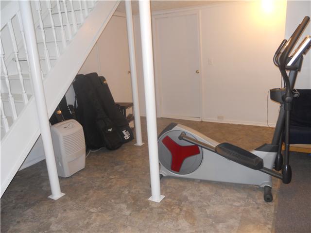232 Manzano Road Madison, TN 37115 - Photo 26 of 30 Here's the other side of the rec room in the basement. Note there is a storage room off this area.