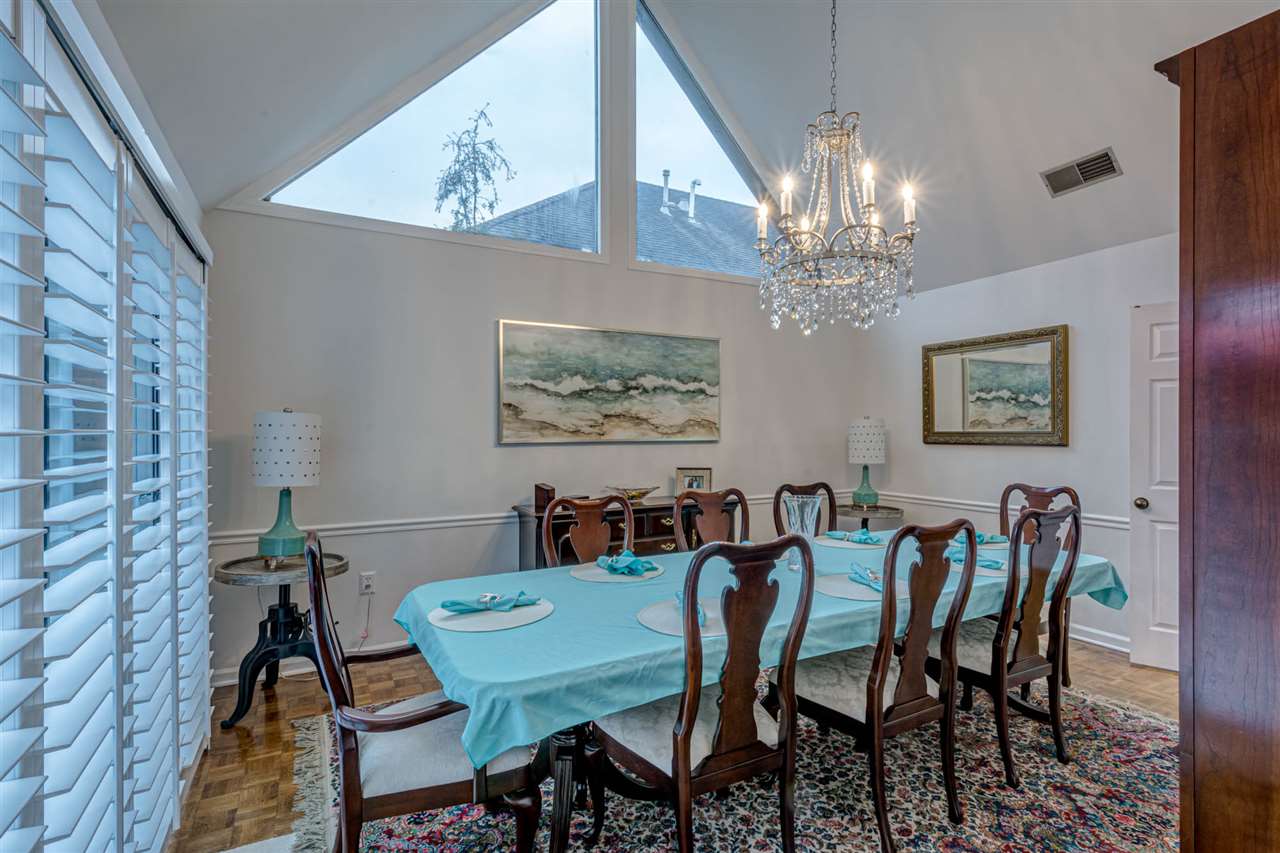 6541 Cherryhill Ridge Memphis, TN 38120 - Photo 8 of 25 16' x 14' Formal Dining Room | Beautiful Wood Parque Floors | Chair Rail | New Sparkling Chandelier | Unique 16th Century Inspiration Triangular Windows | Smooth Ceiling | New Plantation Shutters