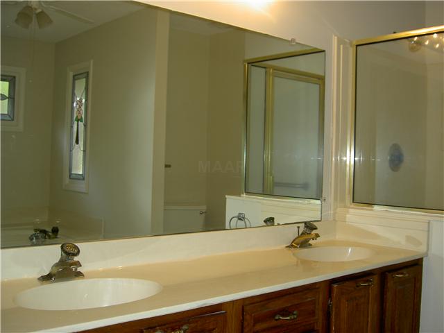 7103 Belsfield Road Memphis, TN 38119 - Photo 13 of 25 Luxurious Master Bath has double vanity, separate shower and whirlpool tub.