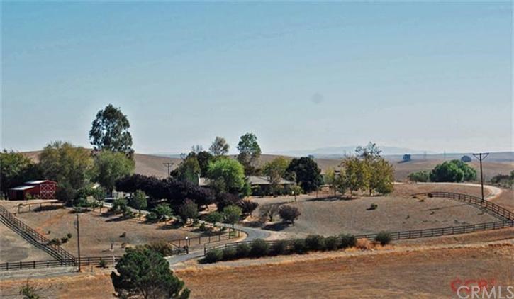 Perimeter fenced 10 acre property with large barn and lovely home.