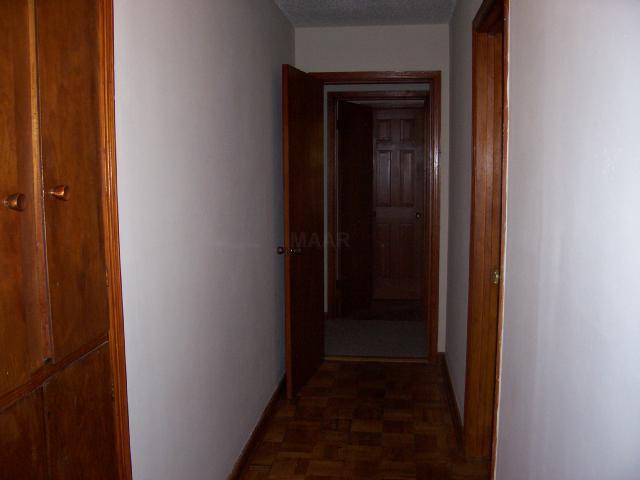 4345 Reed Avenue Memphis, TN 38108 - Photo 6 of 6 Wood Cabinets along side floors in hallway