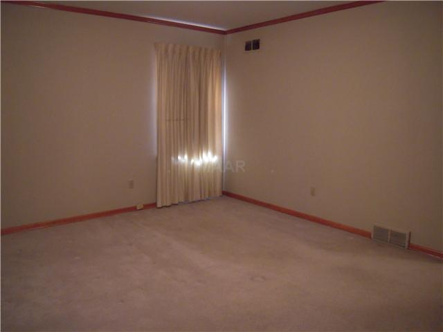 1033 Tatum Road Memphis, TN 38122 - Photo 8 of 13 Bedroom 2, carpet with hardwood under and LG closet.