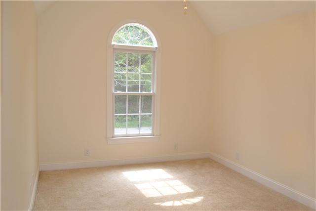 1987 Shell Road Hendersonville, TN 37075 - Photo 8 of 10 The Third Bedroom boasts a soaring vaulted ceiling w/palladian style window providing views of the wooded area in front of the home. It has a nice sized dbl french door closet & a lighted ceiling fan.