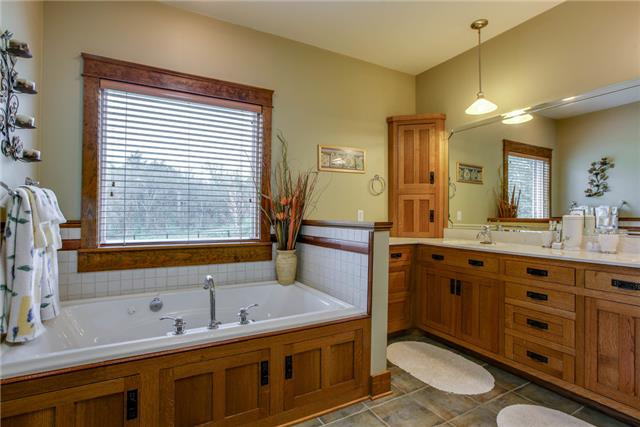 13920 Patterson Road College Grove, TN 37046 - Photo 17 of 30 The master bath features a jetted tub along with double vanities, and large shower.