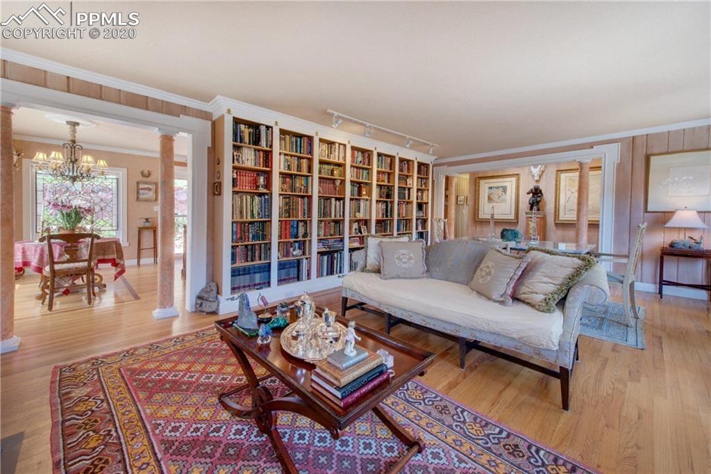 7955 Highway 24 Cascade, CO 80809 - Photo 7 of 36 Main level is bright and offers hardwood flooring