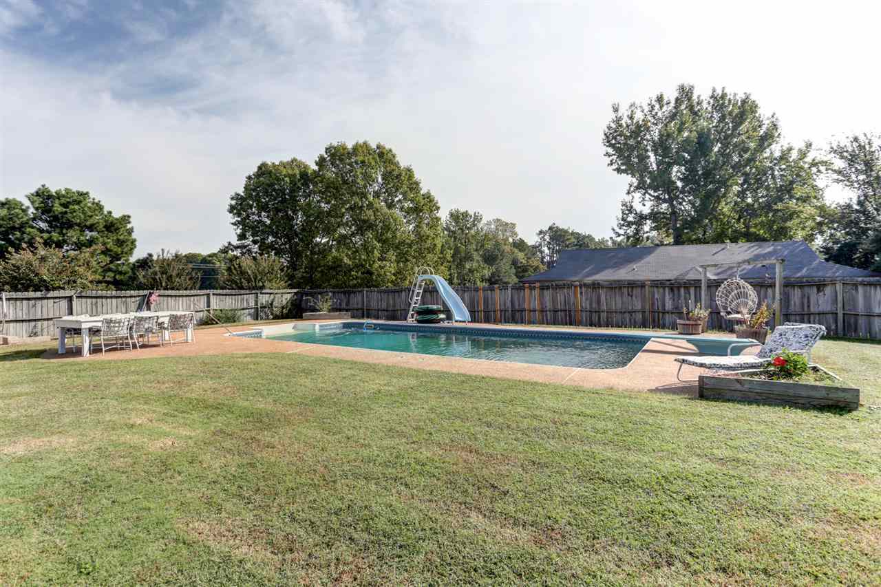 3895 Tracy Road Atoka, TN 38004 - Photo 18 of 21 Come take a dip in this nice in ground pool! Take a ride down the slide, jump in toes first or dive right in!!!