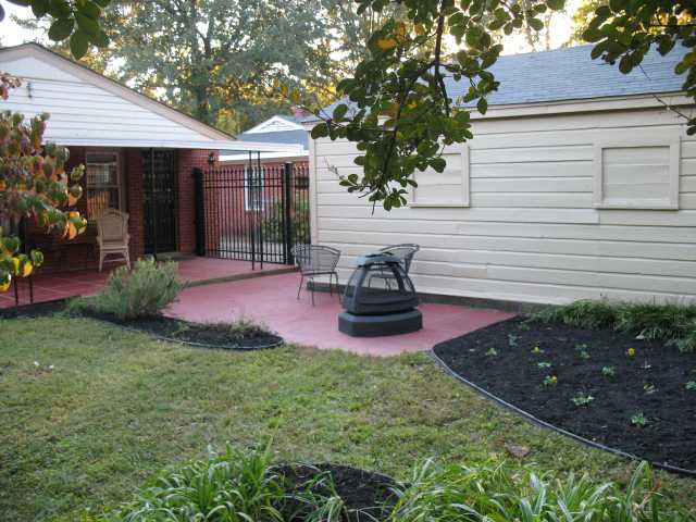 5046 Helene Road Memphis, TN 38117 - Photo 9 of 10 A better view of covered patio, garage and lovely iron fence.
