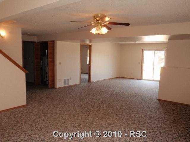 17285 Lodgepole Road Peyton, CO 80831 - Photo 10 of 15 Very large basement Family-room with walkout