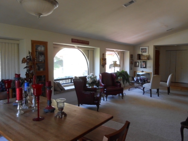 24541 Pappas Road Ramona, CA 92065 - Photo 16 of 25 Large dining room and living room with fireplace.