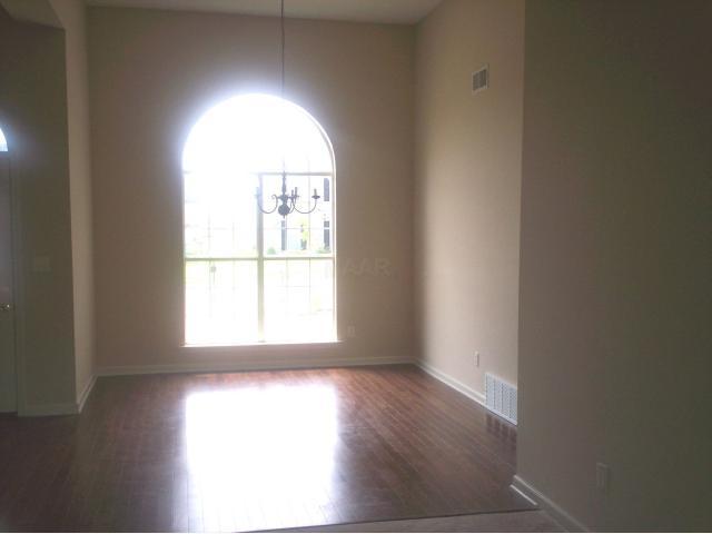 7514 Bevy Ridge Lane Memphis, TN 38125 - Photo 3 of 6 This beautiful dining room has wood floors and 12ft ceilings.