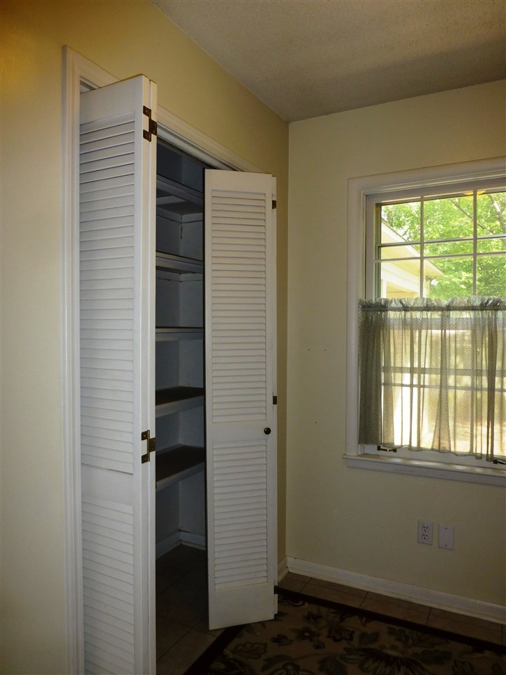 3470 Walnut Grove Road Memphis, TN 38111 - Photo 11 of 25 Extra pantry storage space behind double louvered doors
