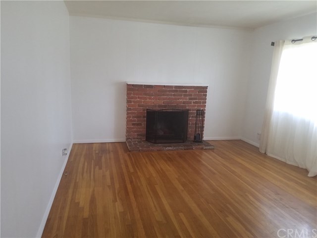 565 East Benbow Street Covina, CA 91722 - Photo 5 of 12 Living room with hardwood floors and fireplace