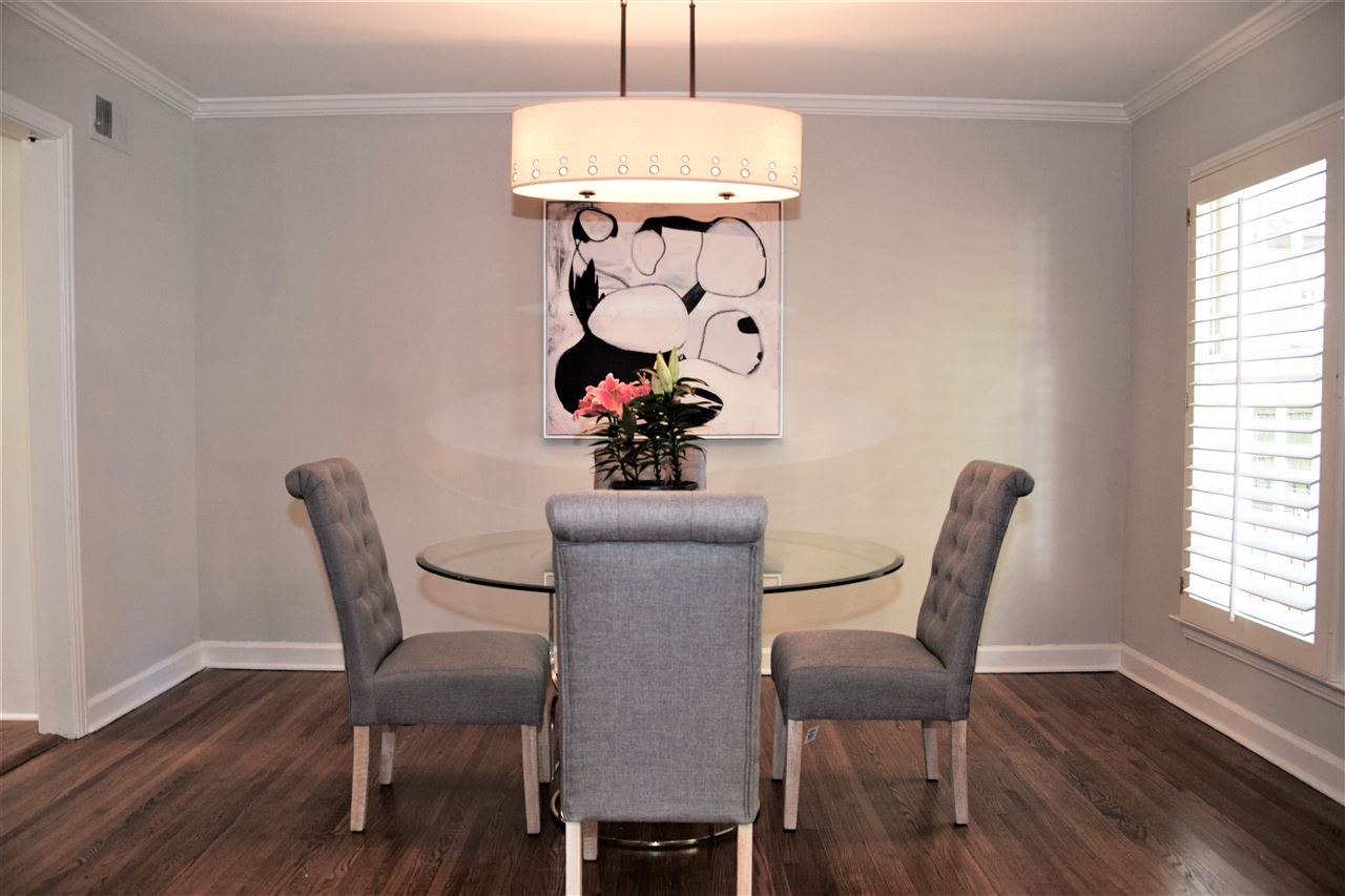 441 Avon Road Memphis, TN 38117 - Photo 8 of 25 Great view of the dining room. New lighting was added throughout the entire house and the whole house has been repainted with designer colors as well. This shows a table with 4 chairs, but you could easily get 6 to 8 chaired table in this room.