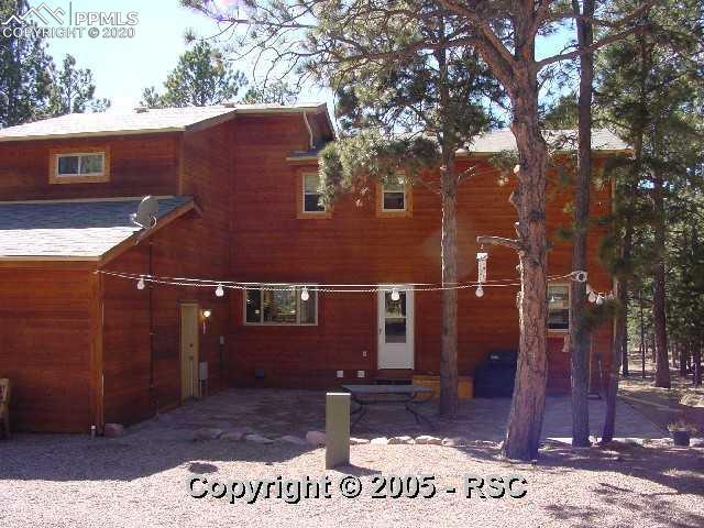 7950 Bar X Road Colorado Springs, CO 80908 - Photo 14 of 14 Portion of Back of Home with patio.