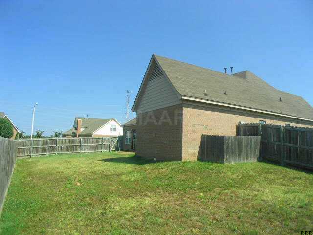 345 North Ericson Road Memphis, TN 38018 - Photo 8 of 8 LARGE Wood-Fenced Rear Yard with Patio on Corner Lot