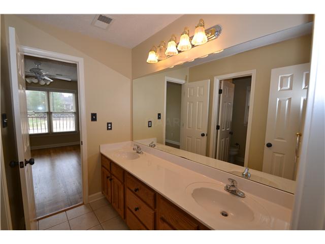 210 Revell Point North Collierville, TN 38017 - Photo 21 of 23 Walk-thru shared bathroom for 3rd and 4th bedrooms with double vanity.
