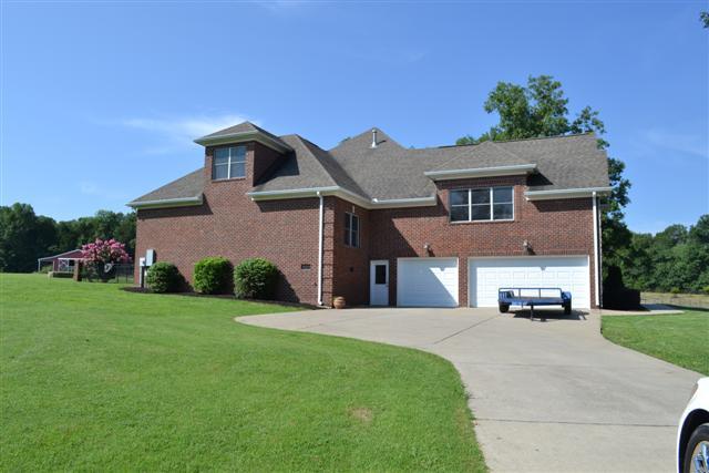 597 Walnut Grove Road Lebanon, TN 37090 - Photo 20 of 24 SIDE OF HOME WITH 3 CAR GARAGE